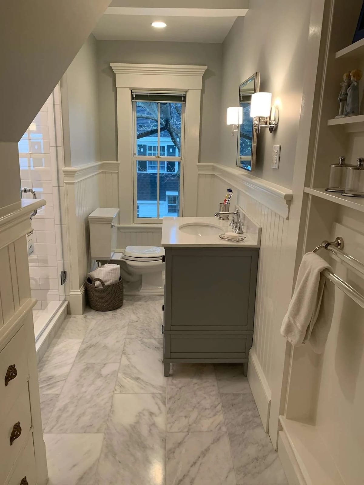Bathroom remodel: gray vanity with wainscoting