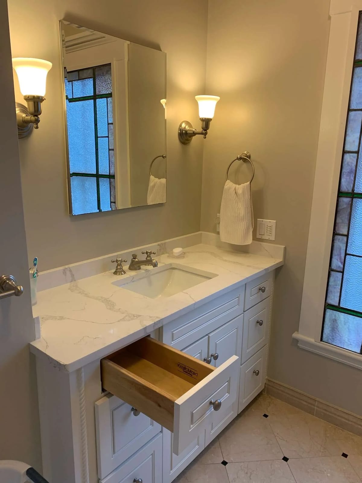 Bathroom remodel: white vanity and sconces