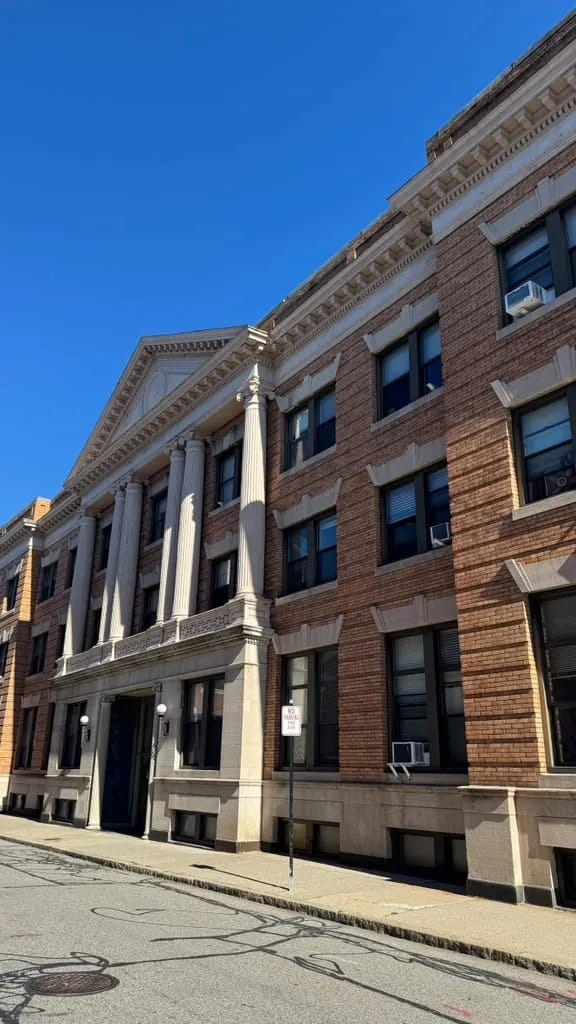 Commercial renovation: brick apartment building, street view