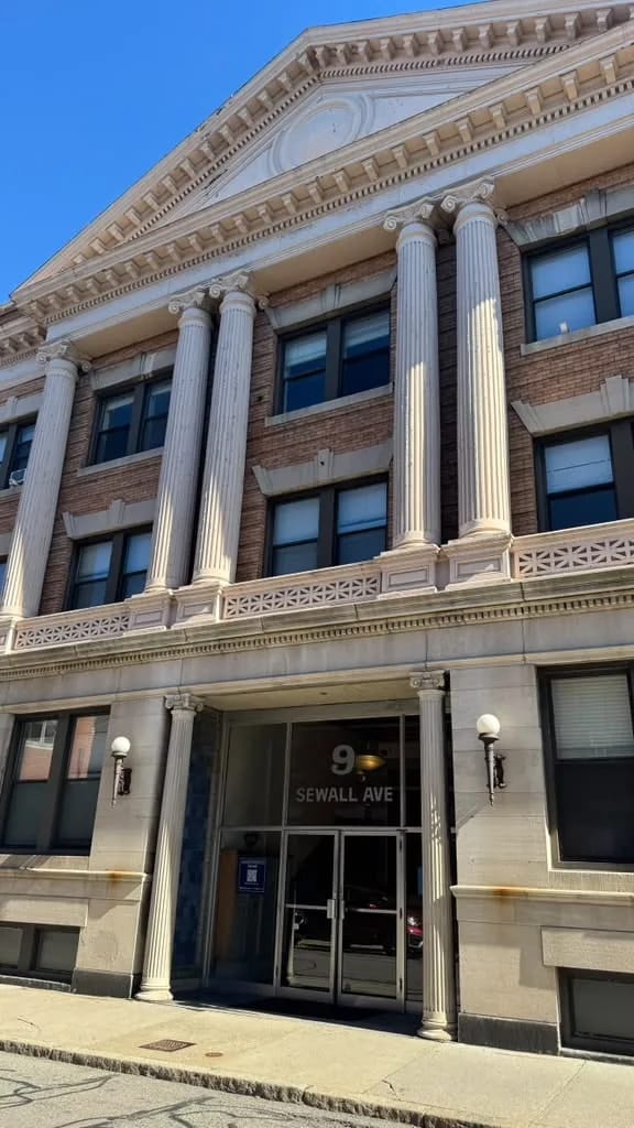Commercial renovation: entrance with stone columns