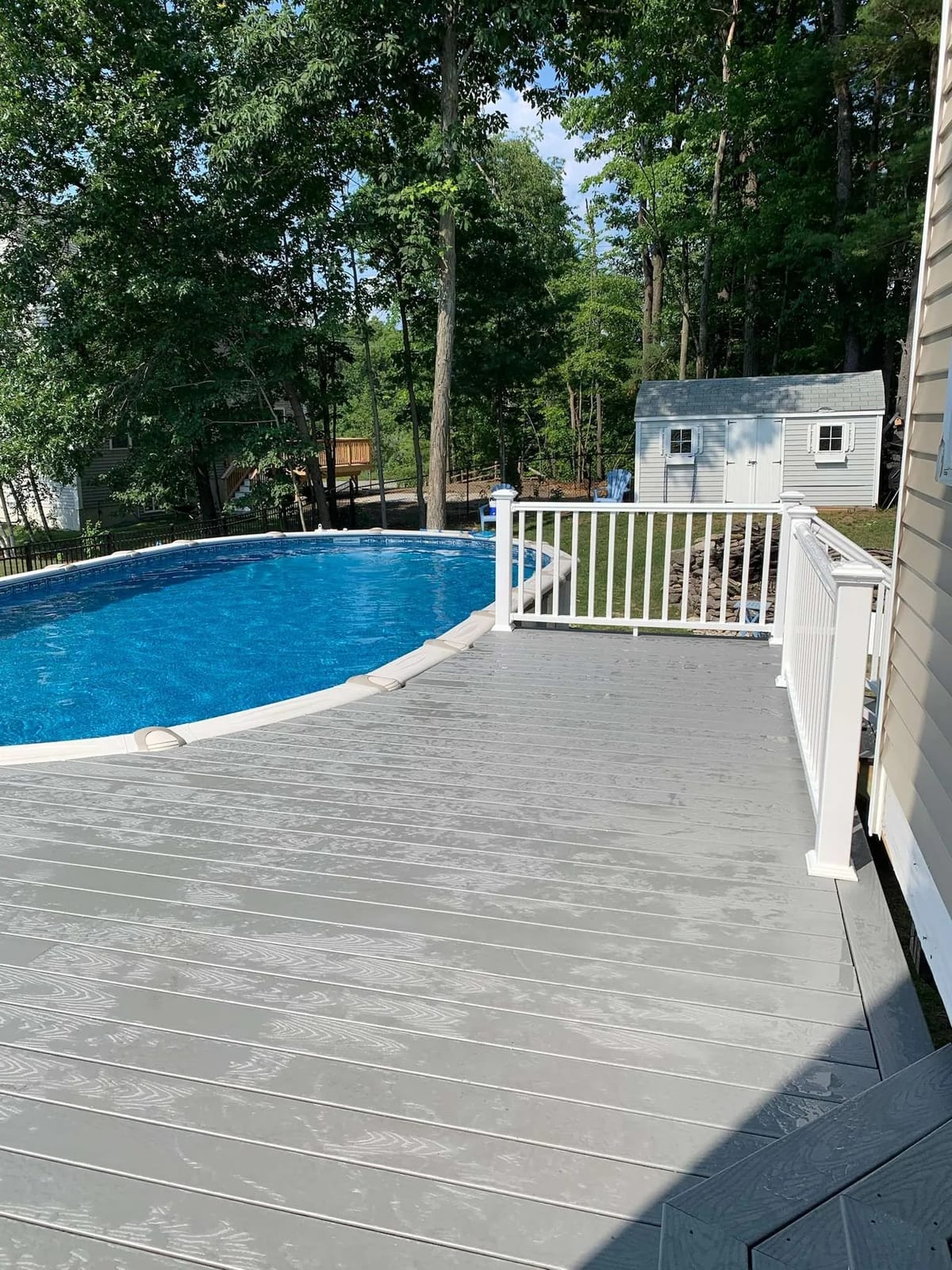 Deck build: pool deck with white railings