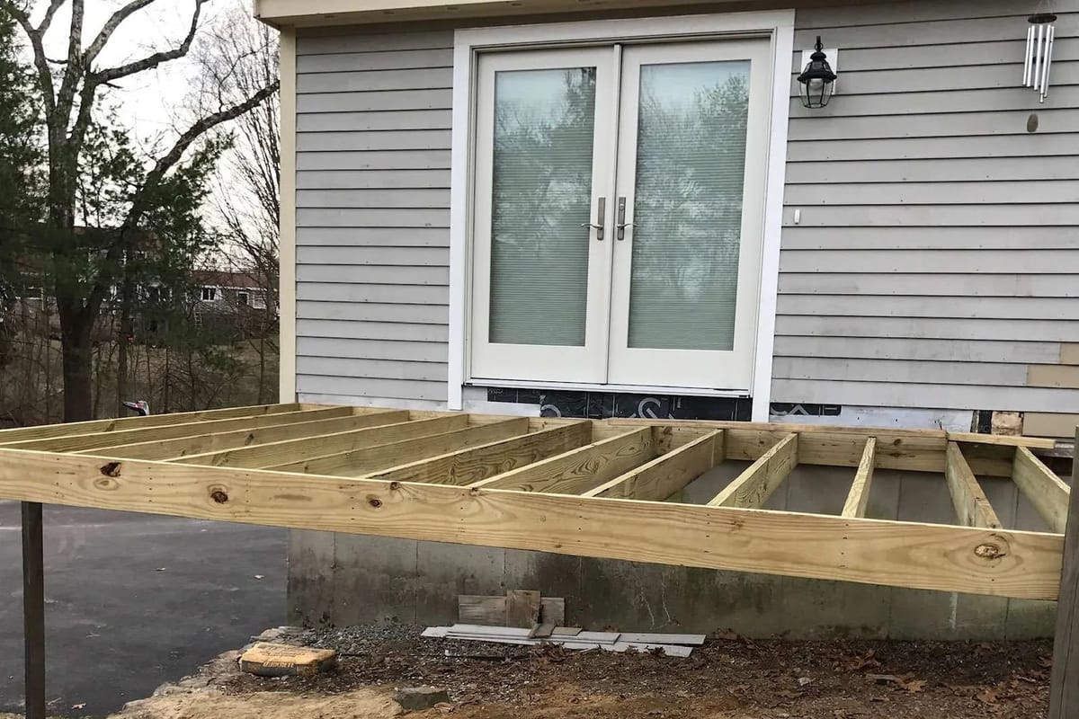 Deck build: old deck removed. New posts and frame in place