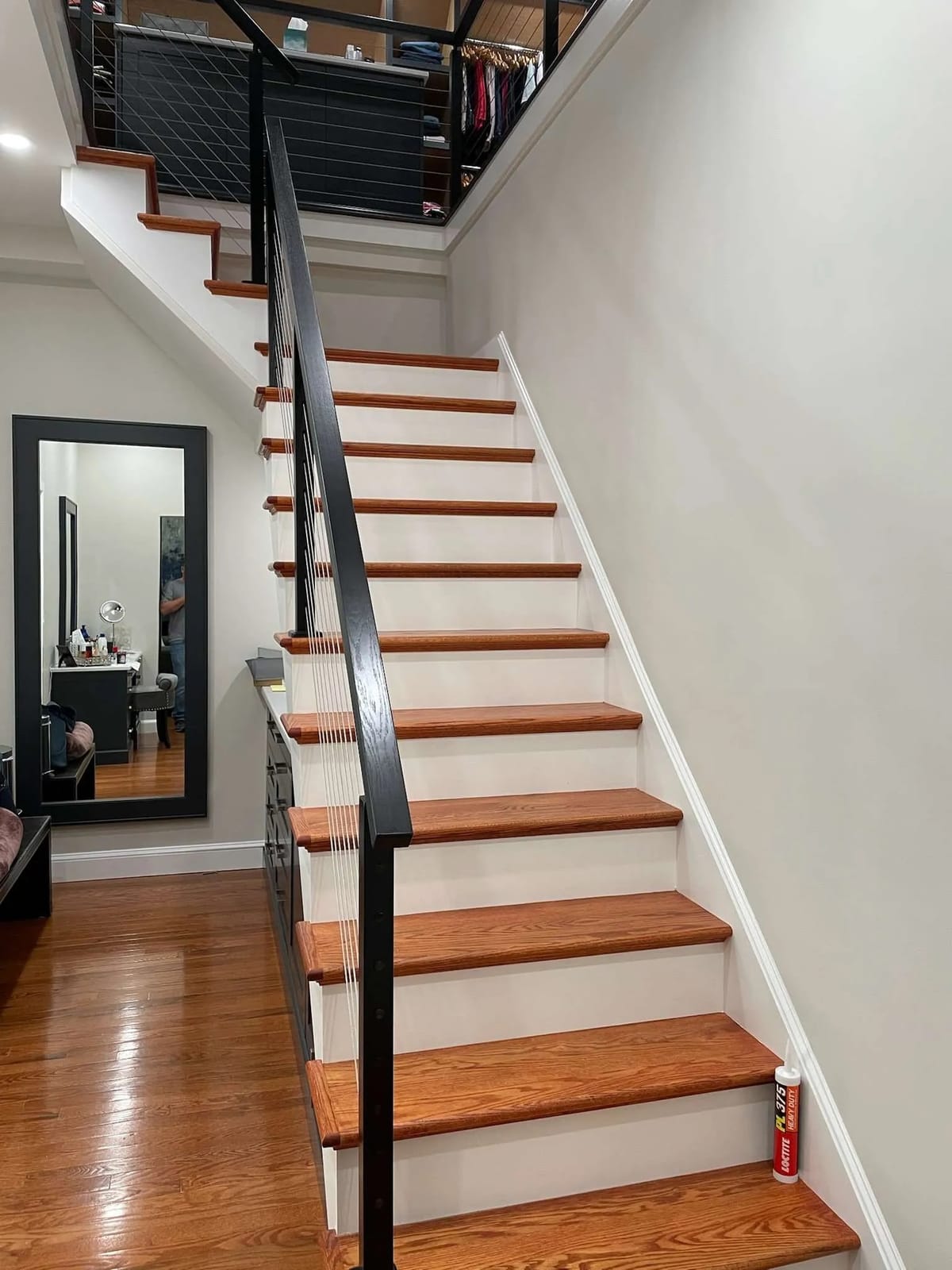 Home renovation: staircase with black handrail