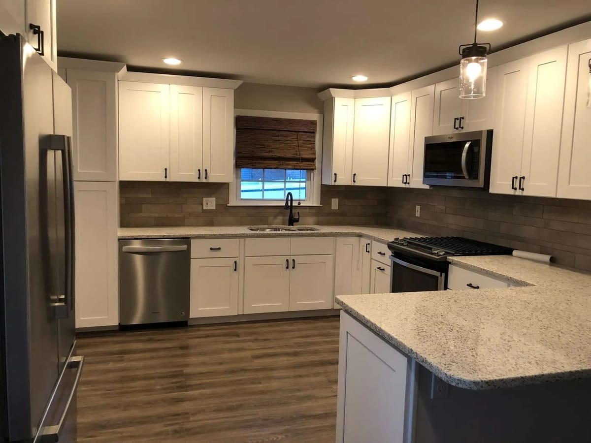 Kitchen remodel: shaker cabinets with stone peninsula