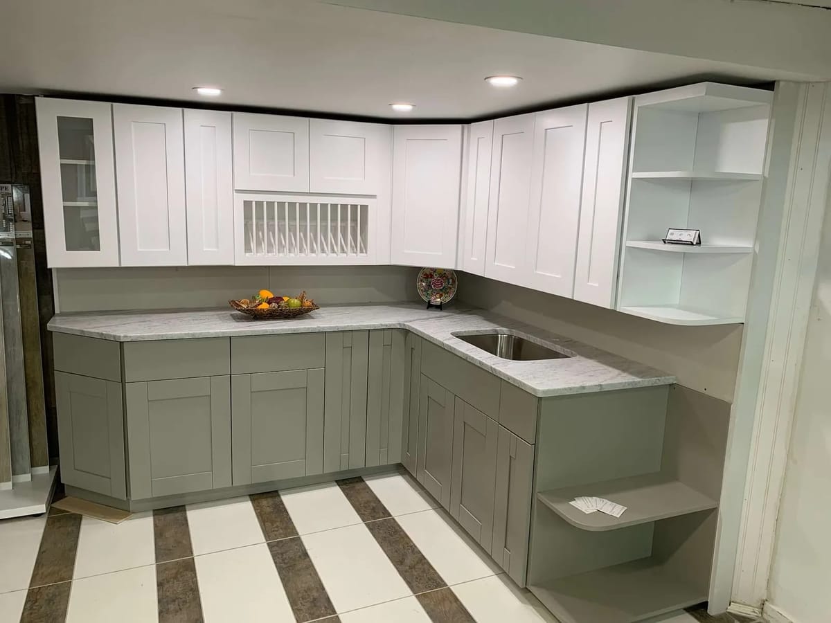 Kitchen remodel: sage green and white L-shaped kitchen